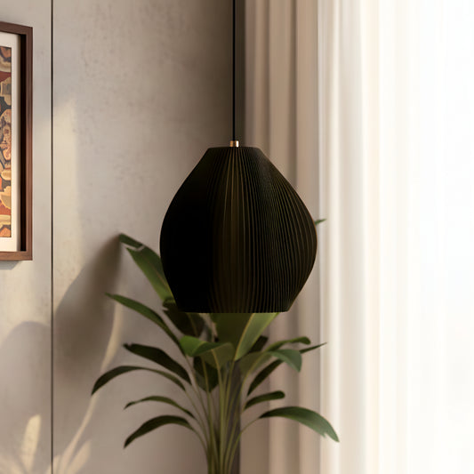 Matte black table lamp with a curved sculpted form and soft glow