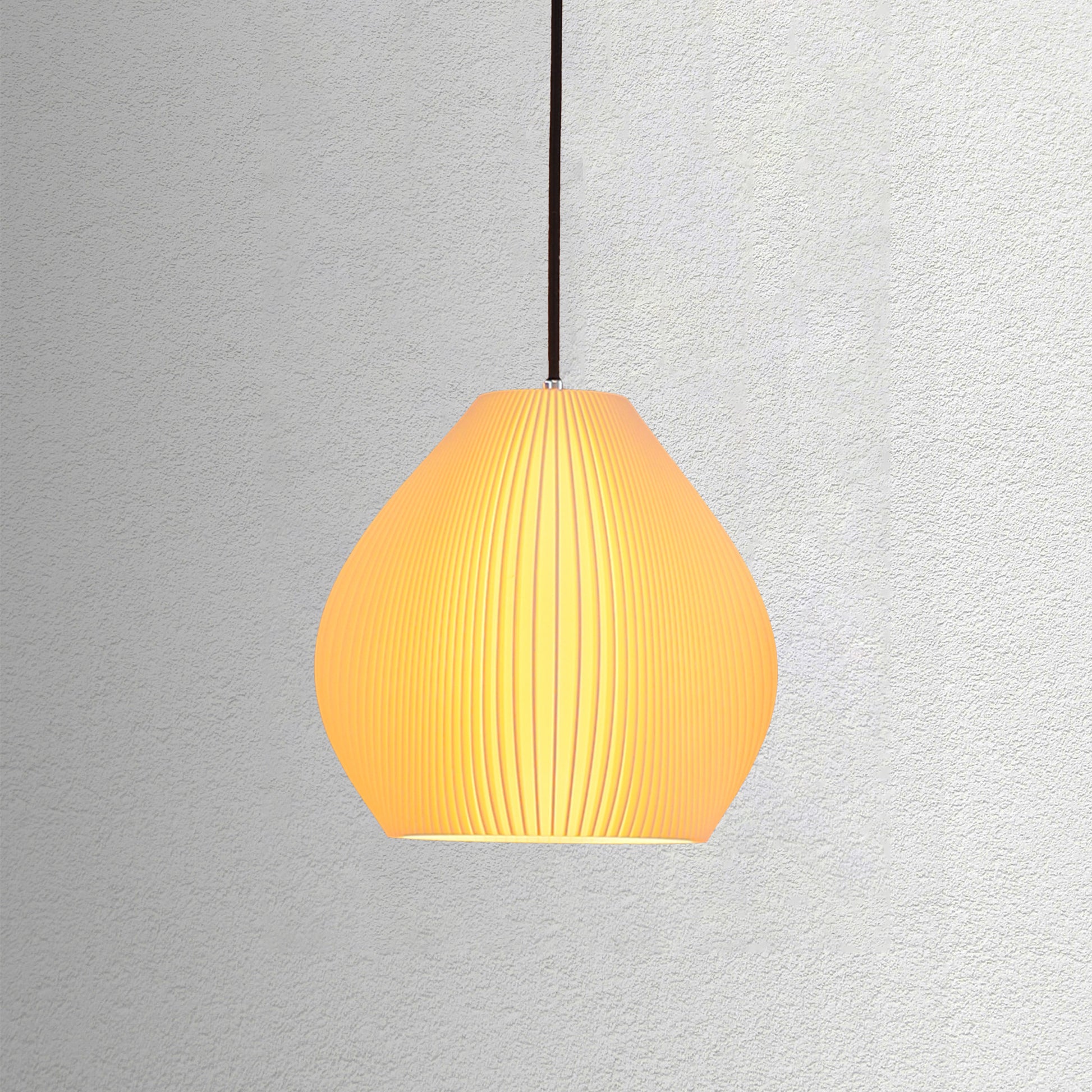 Neutral table lamp with a curved sculpted form and warm glow