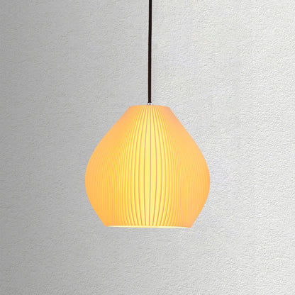 Neutral table lamp with a curved sculpted form and warm glow