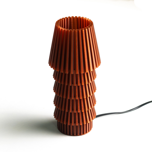Neutral table lamp with a refined silhouette and soft glow