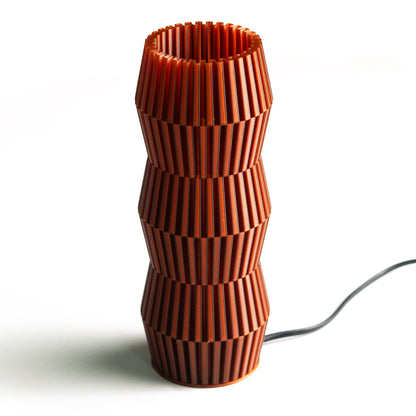Neutral table lamp with a smooth form and soft warm glow