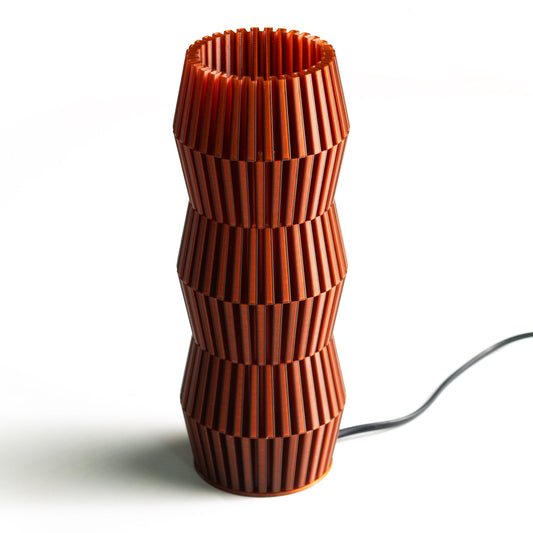 Neutral table lamp with a smooth form and soft warm glow