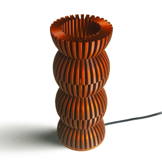 Neutral table lamp with a soft rounded form and warm glow