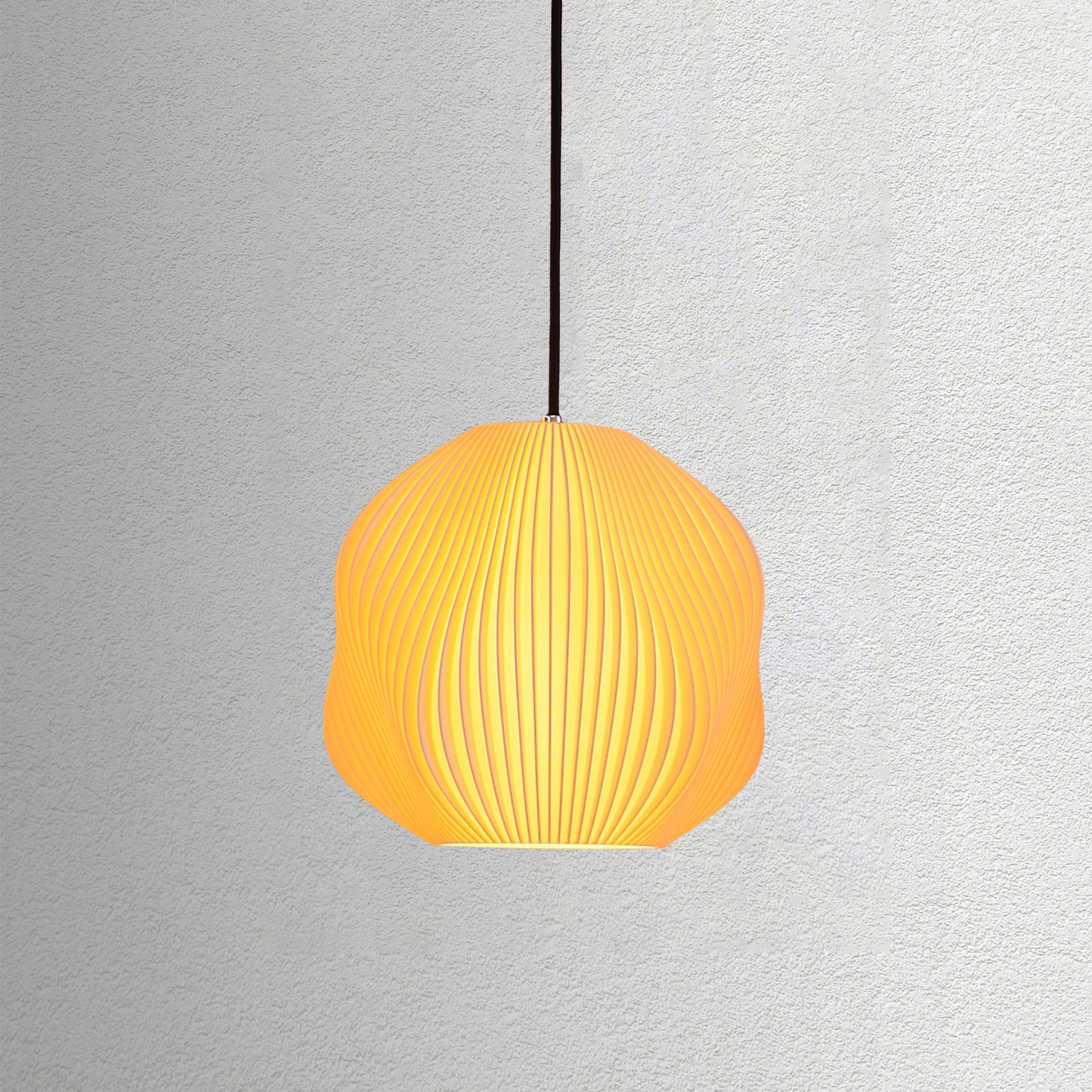 Neutral table lamp with a structured form and soft warm glow