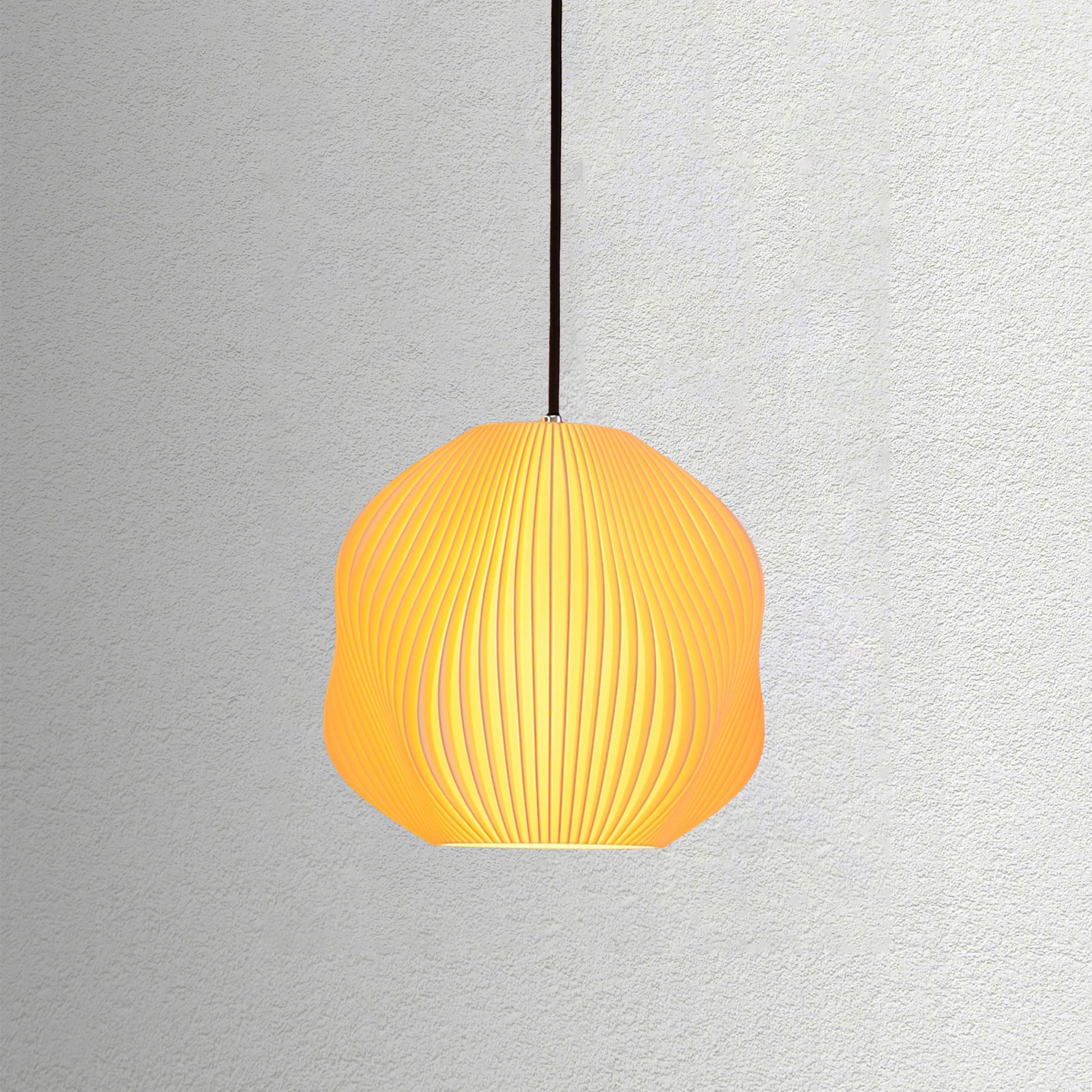 Neutral table lamp with a structured form and soft warm glow