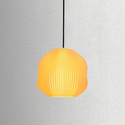 Neutral table lamp with a structured form and soft warm glow