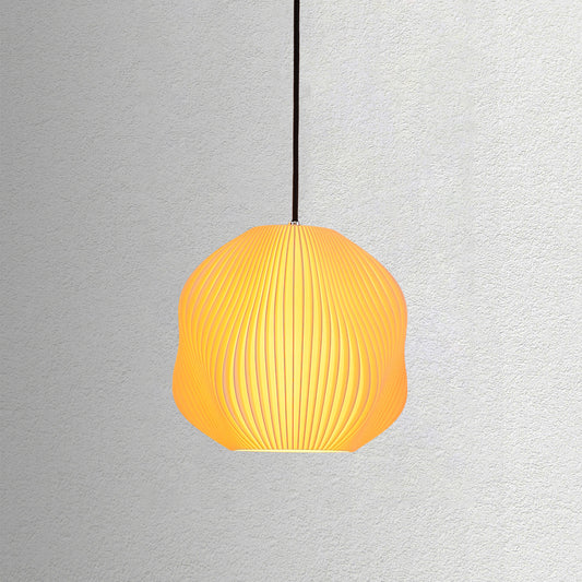Neutral table lamp with a structured form and soft warm glow