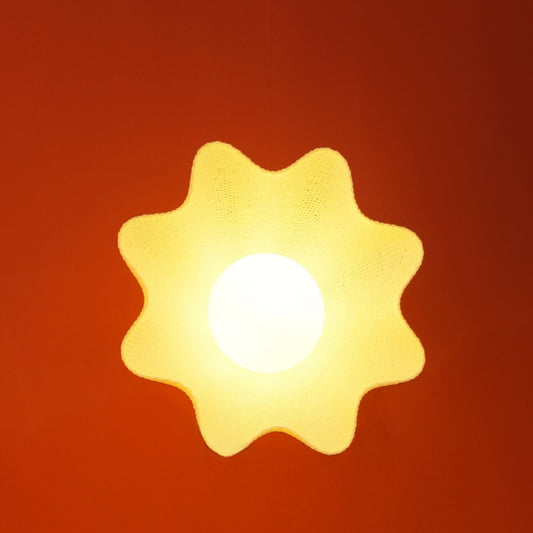 Statement ceiling fixture with subtle vertical pattern