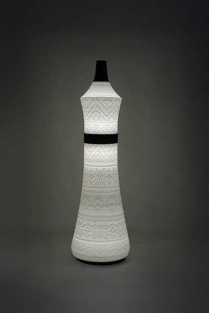 Tall and chic Sutra Queen lamp with warm ambient lighting