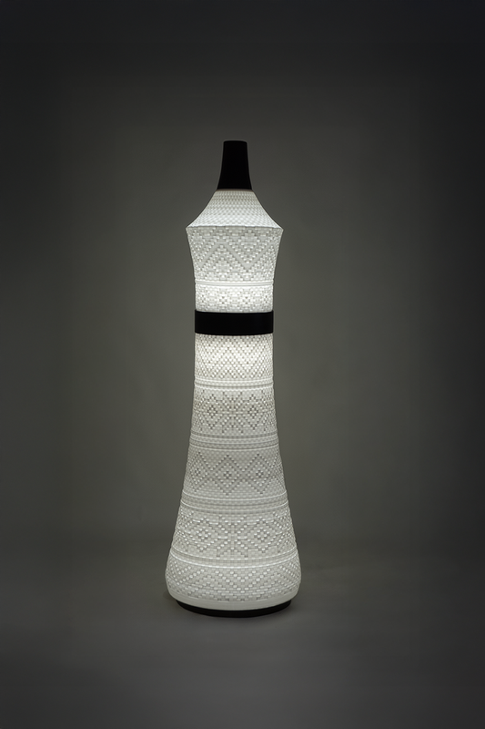 Tall and chic Sutra Queen lamp with warm ambient lighting