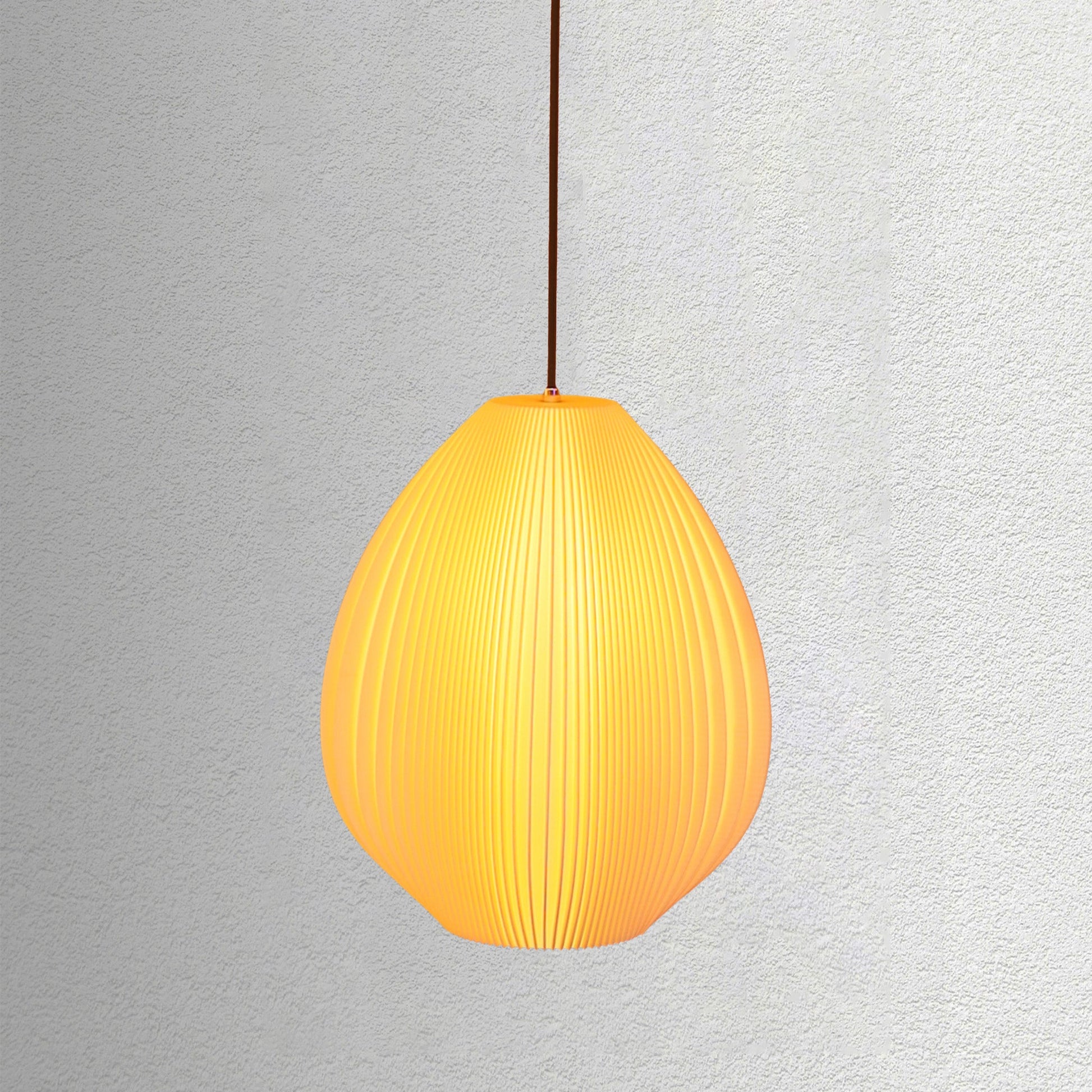 Neutral table lamp with a smooth flowing shape and soft glow