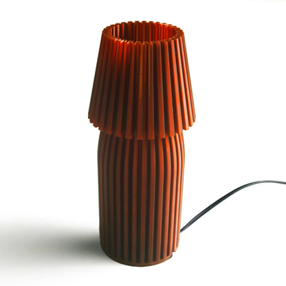 Neutral table lamp with a sleek form and soft warm glow
